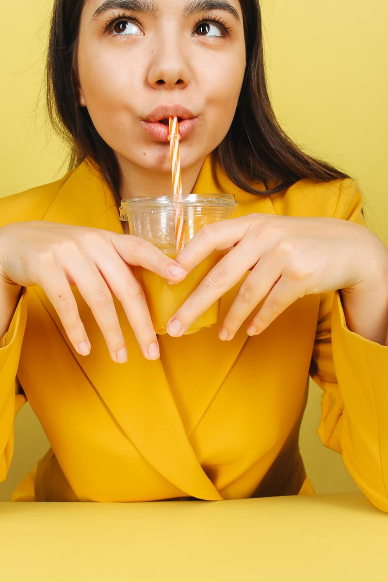 Woman Drinking Orange Juice