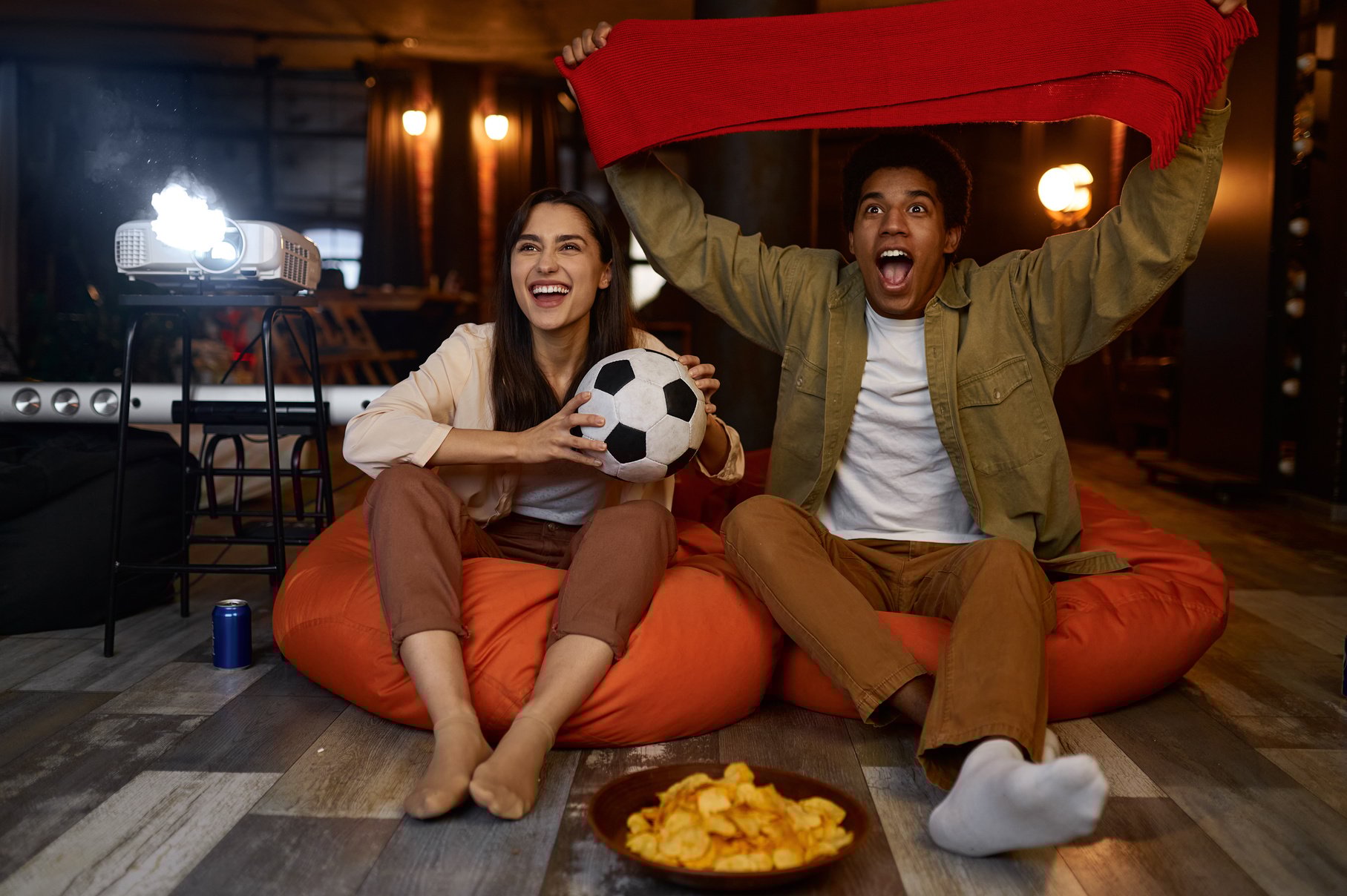 Couple Watching Football Match on Home Projector