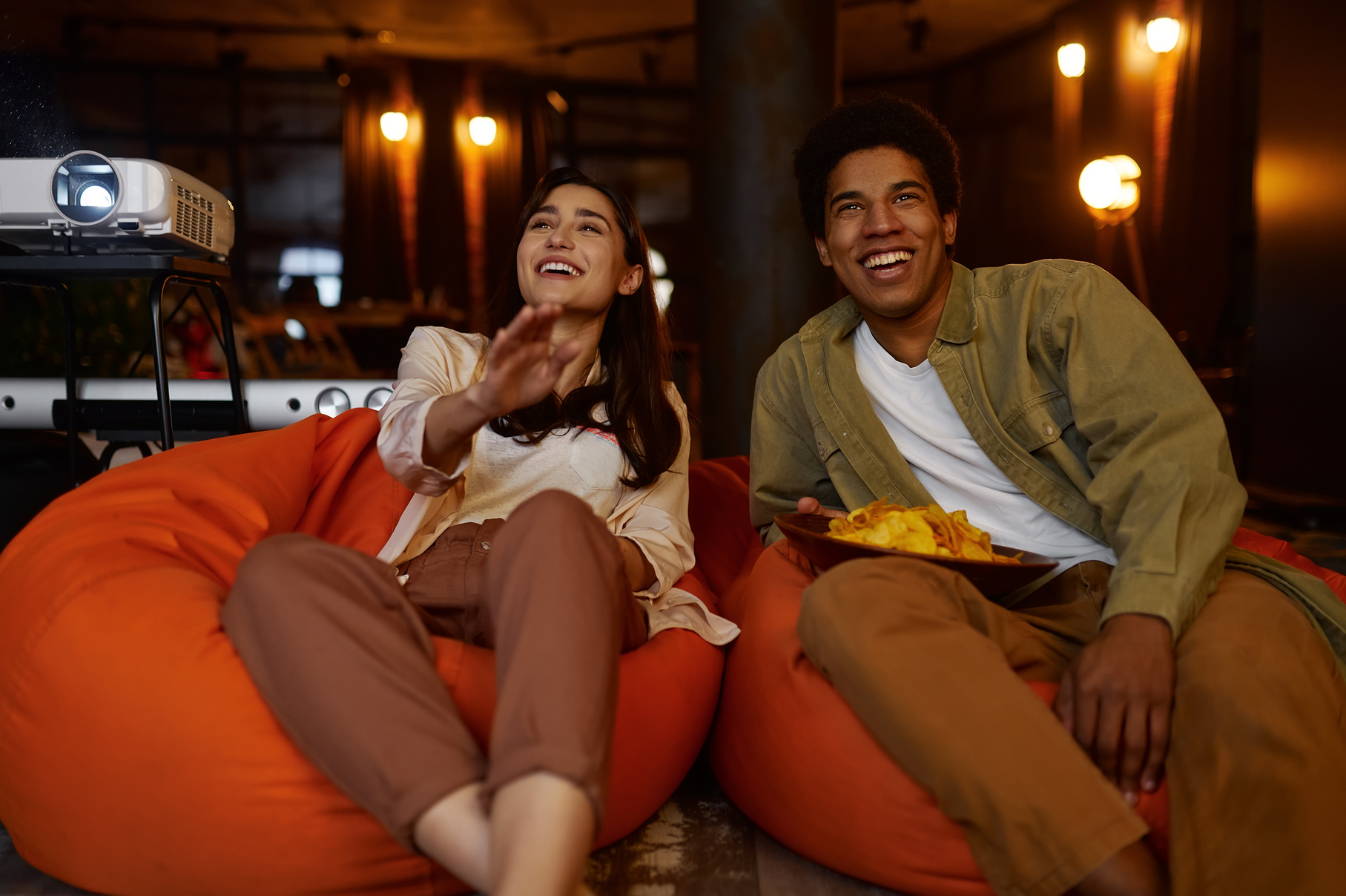 Couple Watching Television Projector at Home