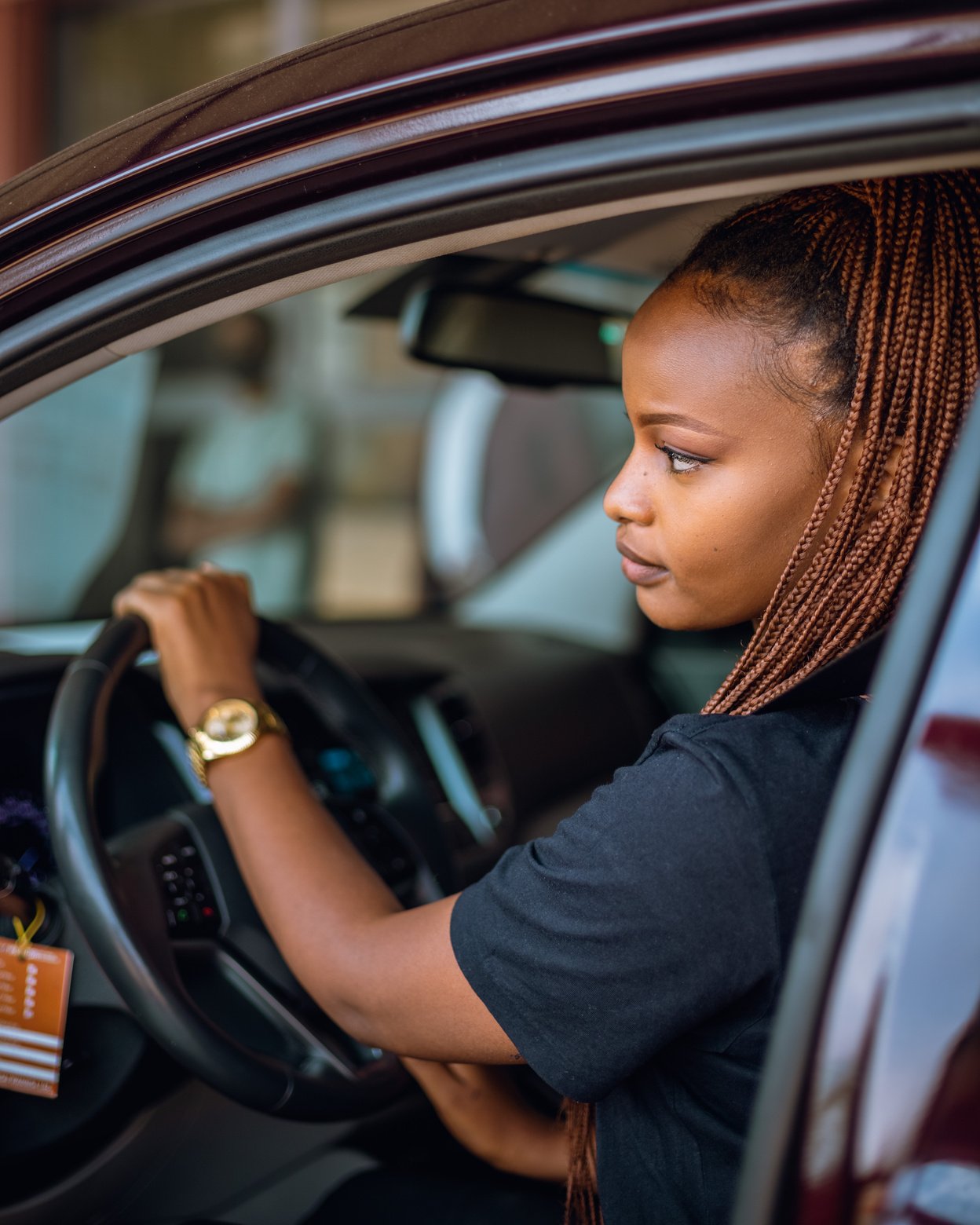 Woman in Black T-shirt Driving Car